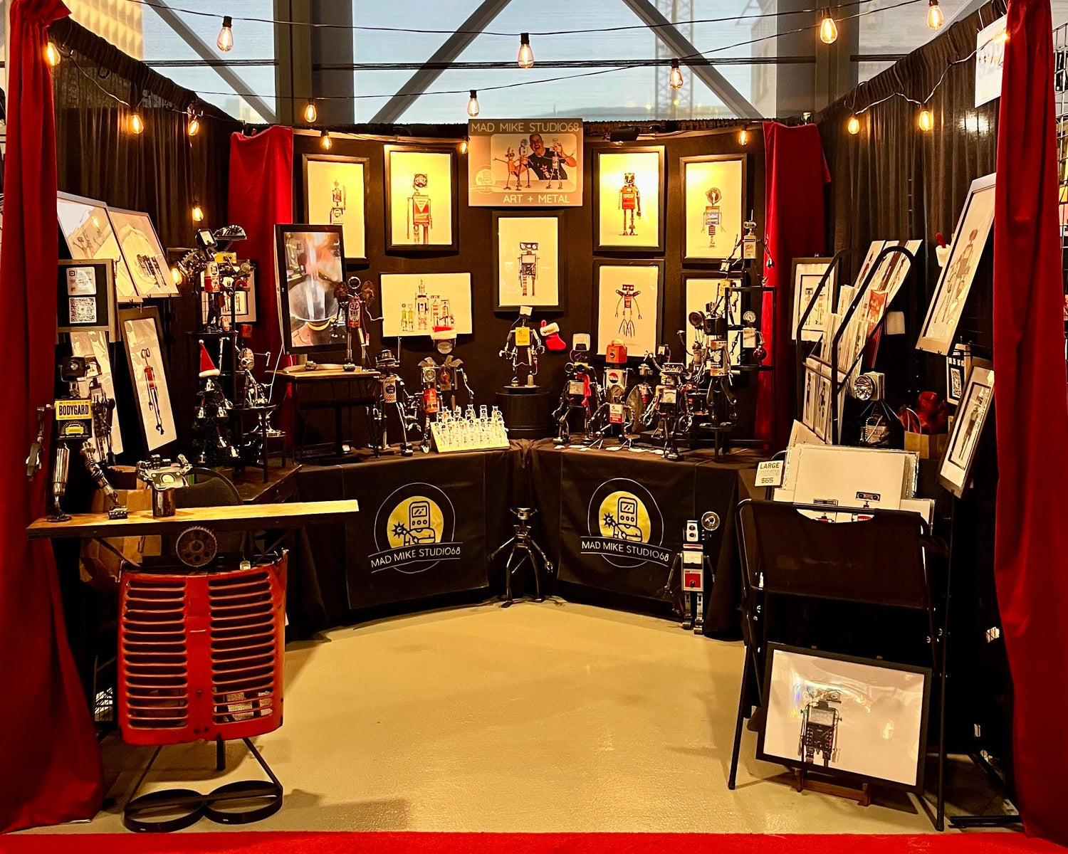 Art Market booth displaying scrap metal robots and robot art print