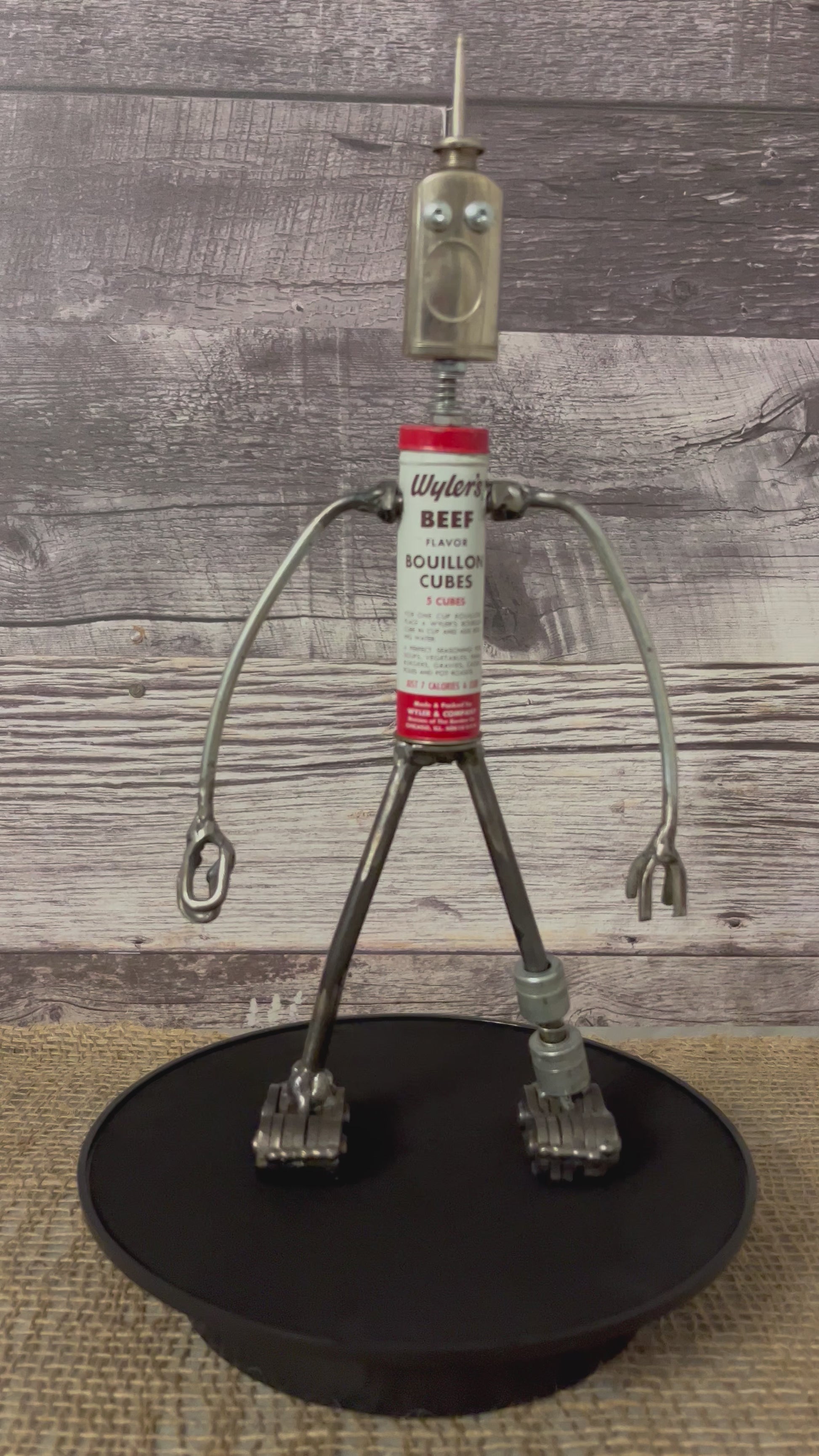 Meet Wyler!  This one-of-a-kind robot scrap art sculpture is made from a vintage beef bouillon cube tin body, vintage mini oiler head with uniquely reimagined scrap metal arms made from lamp parts and scrap metal legs. This bot would look great in a kitchen or in any room décor. 