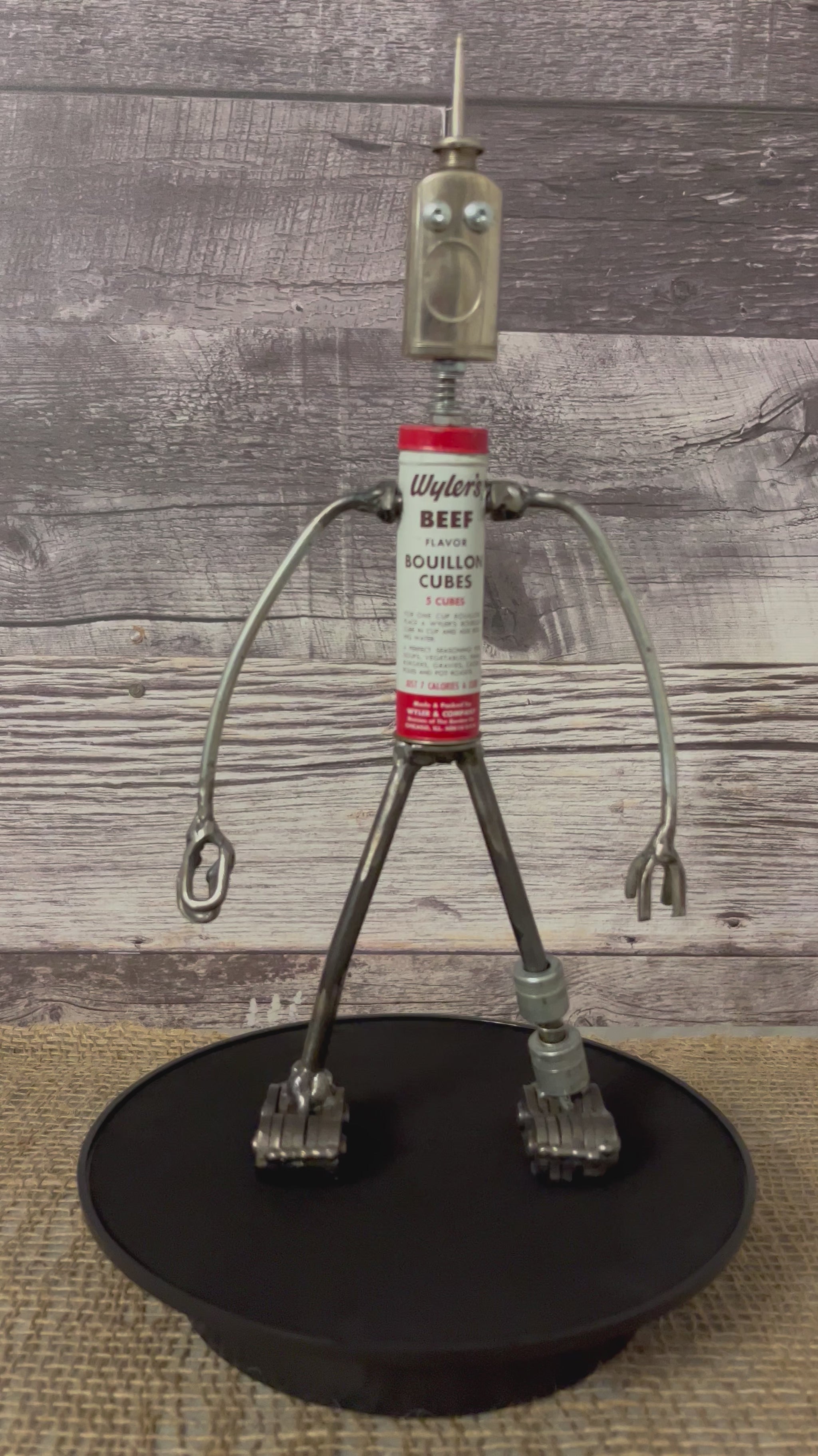 Meet Wyler!  This one-of-a-kind robot scrap art sculpture is made from a vintage beef bouillon cube tin body, vintage mini oiler head with uniquely reimagined scrap metal arms made from lamp parts and scrap metal legs. This bot would look great in a kitchen or in any room décor. 