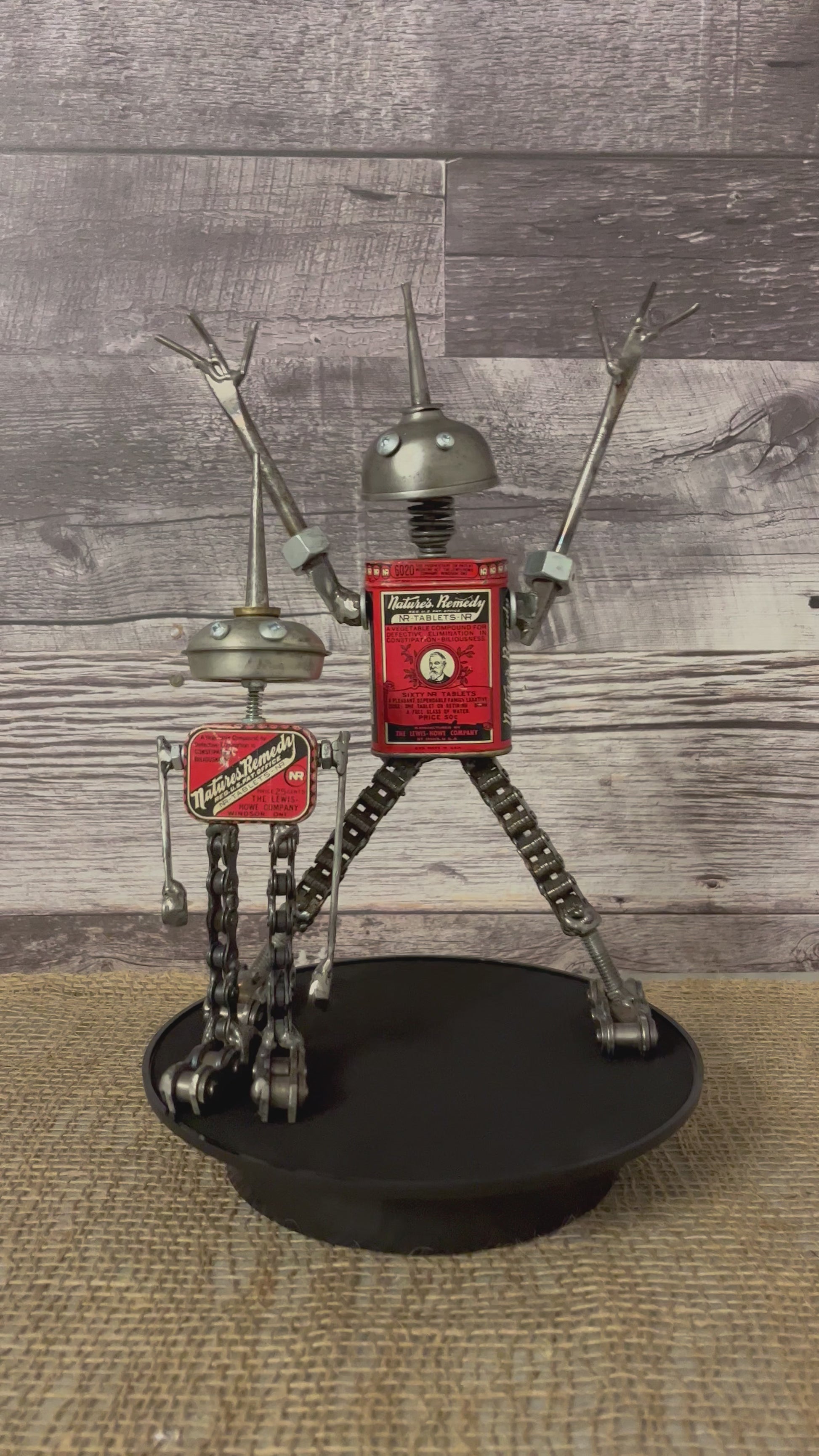 Meet Lloyd and Harry! This set of two, mischievous, one-of-a-kind robot (s)crap art sculptures are both made from matching vintage Nature's Remedy laxative tins for their bodies, oiler heads, (s)crap metal arms and chain legs. Spruce up any shelf in your home, restroom ;) or office with these two unique robot sculptures.  