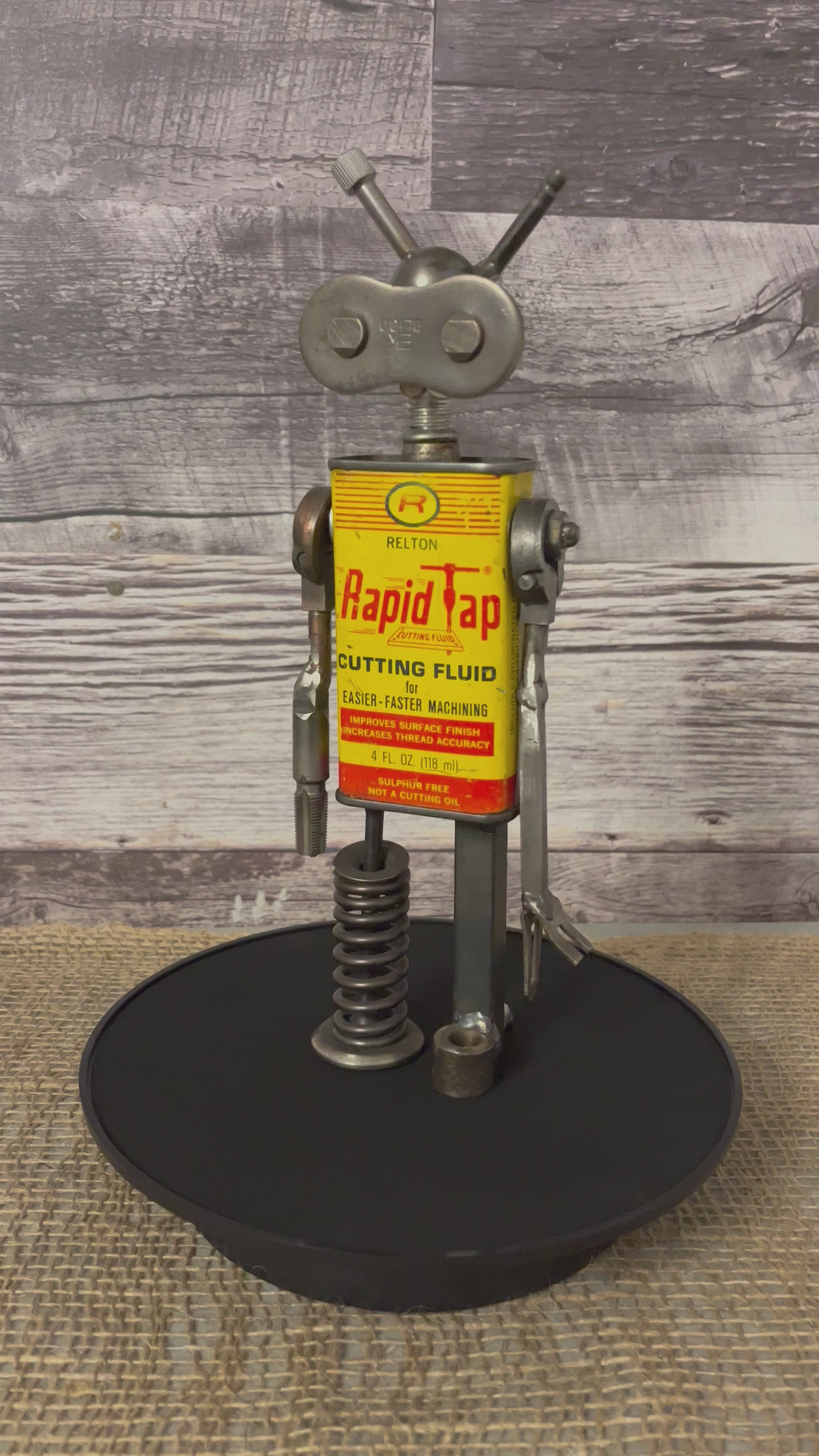 Meet Robby!  This one-of-a-kind robot scrap art sculpture is made from a vintage cutting fluid tin body, scrap metal head, uniquely reimagined singer sewing machine parts for arms and springy scrap metal legs. Spruce up any shelf in your home or office with this unique robot sculpture.  