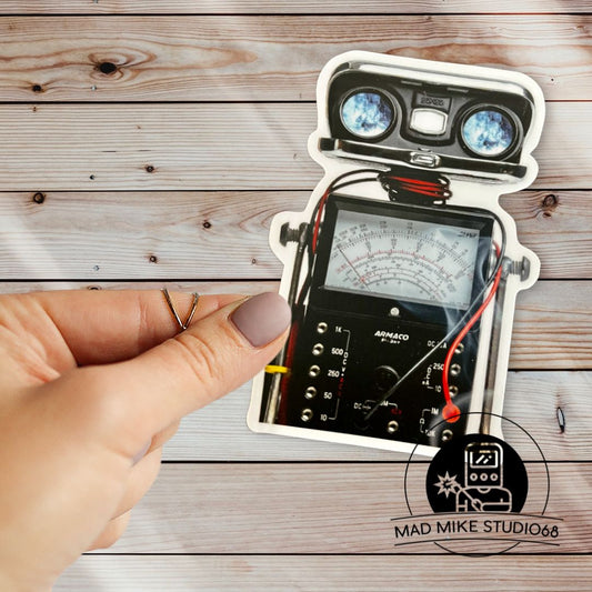 This cute little custom die cut robot scrap art sticker is made of permanent white semi gloss vinyl and measures as follows:  Features:  Metric: 6.35 cm wide x 8.89 cm tall Imperial: 2.5 inches wide x 3.5 inches tall Collect them all!