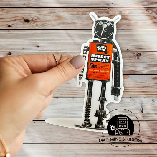 This cute little custom die cut robot scrap art sticker is made of permanent white semi gloss vinyl and measures as follows:  Features:  Metric: 5 cm wide x 10 cm tall Imperial: 2 inches wide x 4 inches tall Collect them all!